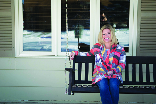Shannon Pippin sits on her porch swing outside her Great Falls home.