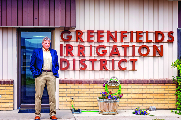 Erling A. Juel, District Manager for Greenfields Irrigation District, shares his knowledge of the Sun River Project from the District’s office in Fairfield.