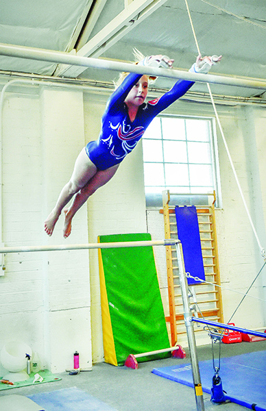 Fearlessness, along with talent, is an imperative characteristic of gymnasts who push to the next level. Here, Sami Franzcyk works towards certification to Level 7 on the high bar.