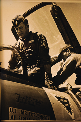 Lee preparing to strap in to the cockpit of a B-57.