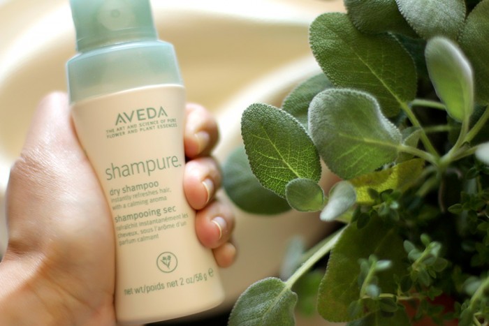 Shampure Dry Shampoo by Aveda This is a non-aerosol powder mist that absorbs excess oils and lifts impurities away from the hair. It is a 99.8 percent naturally derived formula. Because of it’s scent it’s like a relaxing Sunday afternoon at the spa.