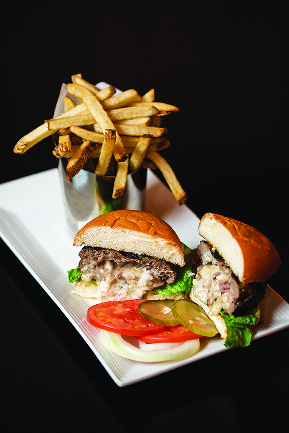 Coming in at a half pound and filled with bacon, bleu cheese and gouda, the Stuffed Burger is the biggest burger on the menu.