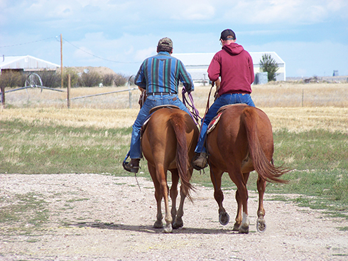 Phil Schroeder and his son, Jordan, often go horseback riding together.  They find it therapeutic after a long day. Photo courtesy of Jean Schroeder.